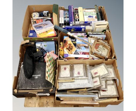 A pallet of five boxes of photograph frames, antique reference book, games, vintage videomaster etc 