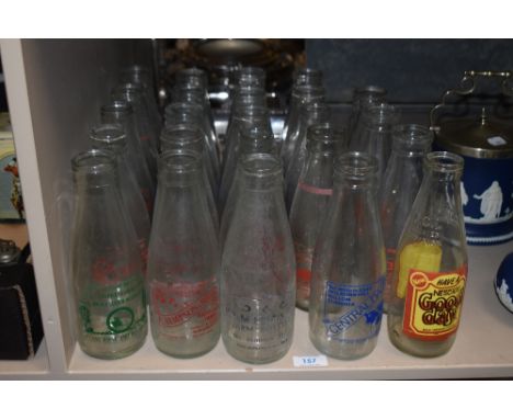 A collection of vintage advertising milk bottles, including Millom, Blackburn, Dumfries interest etc.