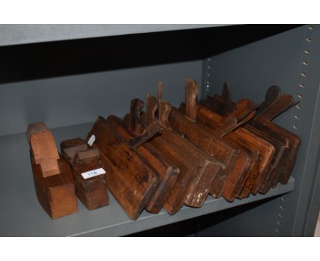 Two vintage wood planing tools and a selection of wooden moulding planes