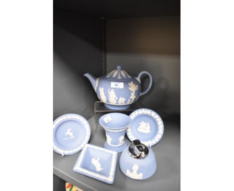 An assorted collection of Wedgwood blue jasperware, to include a teapot, table lighter, and flared vase