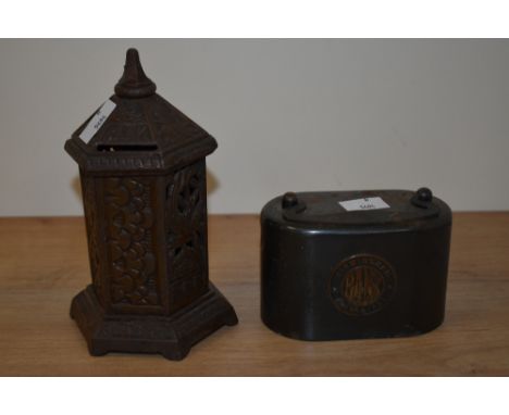Two vintage metal money boxes, one of cast metal with bird decoration in the form of a post box.