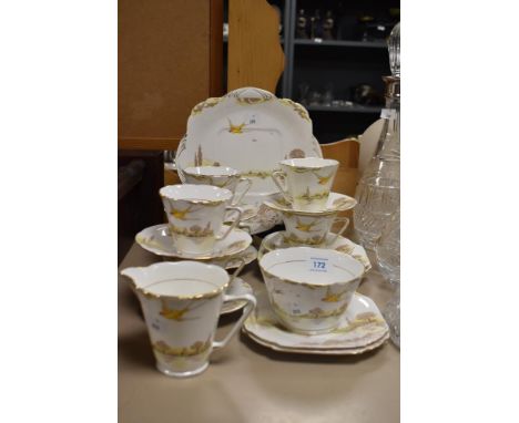 A selection of Grafton tea wares, including cups, saucers, plates, sugar basin and jug, having swallow and countryside decora