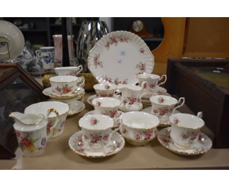 A selection of Royal Albert 'Lavender Rose' cups, saucers, cake plate, sugar basin and cream jug, sold with an assortment of 