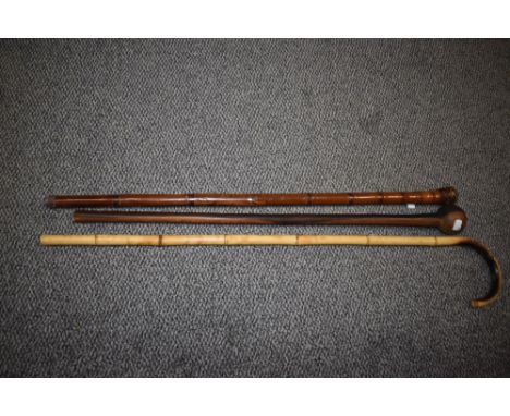 A South African knob kerri, a bamboo walking stick and similar can with carved oriental decoration.