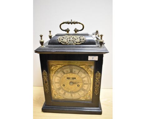 A late 17th Century ebonised bracket clock, John Clowes of London, the case having a caddy top, gilt metal mounts, side and r