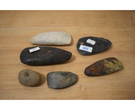 A collection of natural stone axe heads, of Papua New Guinea interest.
13cm, 12cm, 11cm x 2, 7cm &amp; 5cm, unfortunatly no f