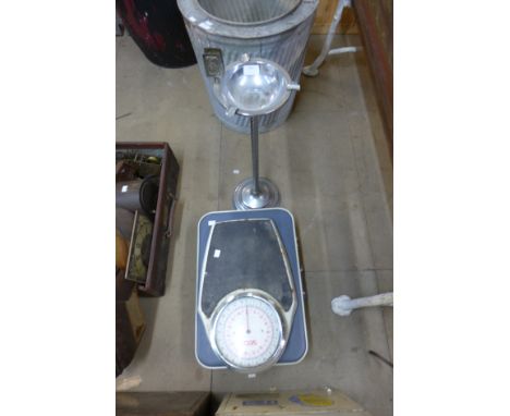A chrome smokers stand, scales and a suitcase