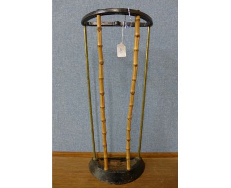 A small cast iron and bamboo stick stand