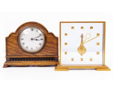 A SWISS MADE GILT METAL AND PERSPEX MANTLE CLOCK with a presentation inscription, 18cm wide x 16cm high together with a eight