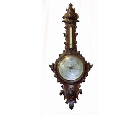 A VICTORIAN OAK CARVED BAROMETER the dial marked D.Luvate Preston, with silvered dial and gauge, 110cm approximately overall