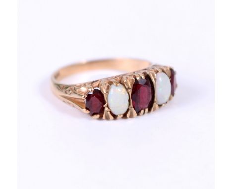 A 9 CARAT YELLOW GOLD FIVE STONE OPAL AND RED STONE RING size P 1/2, overall weight 3.3 grams approximately