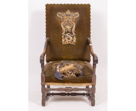 AN UPHOLSTERED ARMCHAIR with scrolling arms and a tapestry crest inset back, 63cm wide x 72cm deep x 118cm high