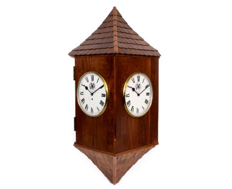 A CORNER WALL CLOCK the dial painted with the GWR logo, the movement with fusee previously part of a two sided station clock,
