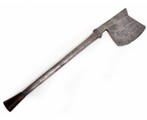 AN ANTIQUE STEEL AXE with stamped decoration and associated handle 62cm long and the blade 13.5cm deep