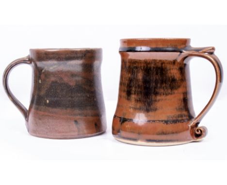 A ST IVES STUDIO POTTERY TANKARD, POSSIBLY BY DAVID LEACH, with applied scrolling handle with seal mark to base and a David L