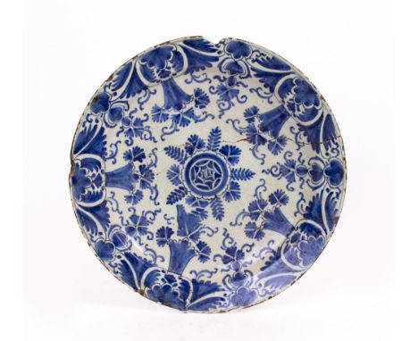 AN EARLY 19TH CENTURY TIN GLAZED DELFTWARE CHARGER  with restoration, approximately 35cm