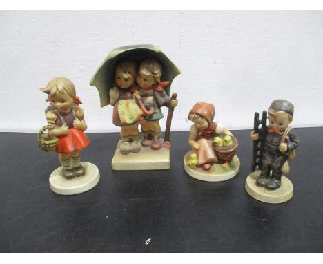 A collection of four West Germany goebel figurines.