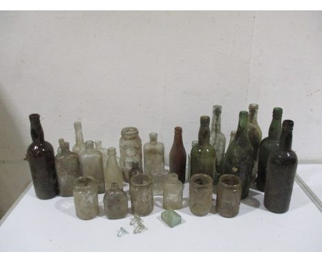 A collection of vintage bottles and jars