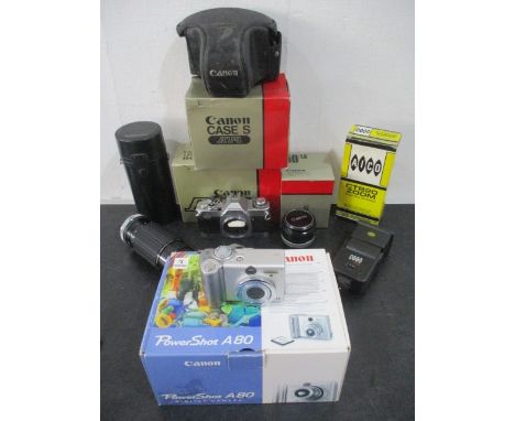 A Canon AV1 camera with 50mm lens, along with a Sigma 80-200mm lens, Canon Powershot A80 etc.