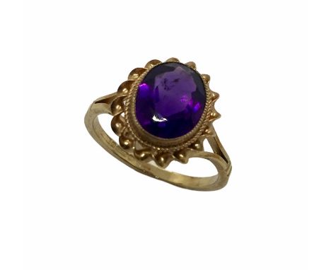 A 9 ct gold ring set with an amethyst