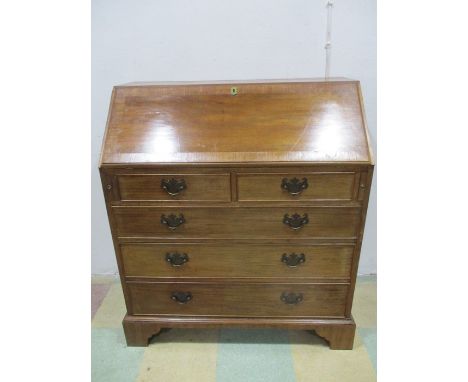A Georgian style bureau with bracket feet