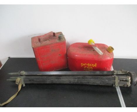 Two vintage petrol cans, along with a tripod