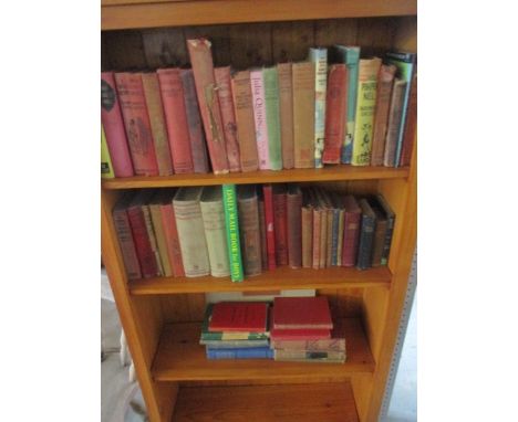 A collection of vintage books including Robin Hood, Robinson Crusoe, Scarlett Pimpernel