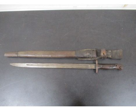 A 1907 pattern Lee Enfield bayonet in leather scabbard- various proof marks to blade