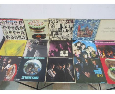 A collection of fifteen Rolling Stones 12" vinyl records including Sticky Fingers, "Exile On Main St", Let It Bleed, Beggars 