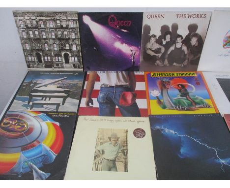 A collection of 12" vinyl records including Led Zeppelin, Queen, ELO, Jefferson Starship, The Doors, Dire Straits, Lynyrd Sky