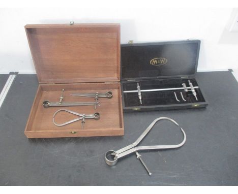 A cased M&amp;W beam compass, along with calipers etc