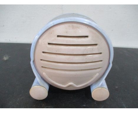 An Art Deco shaped speaker in blue and pink bakeite