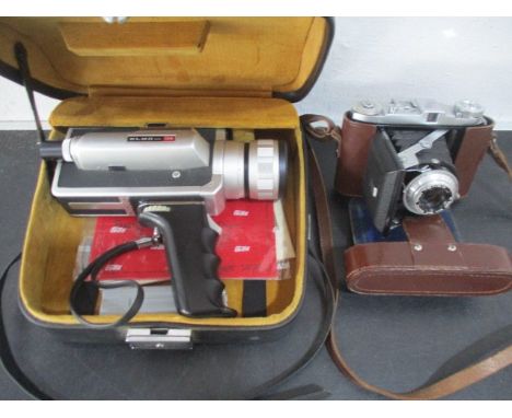 A Balda Baldix camera in leather case along with an Elmo 106 cine camera
