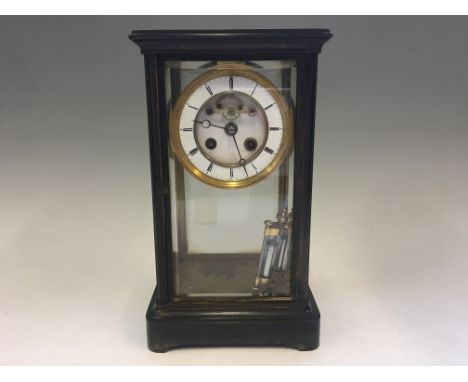 A brass and glass cased mantel clock with mercury filled pendulum, height 30cm.