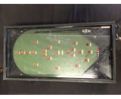 A vintage tabletop pinball bagatelle game.