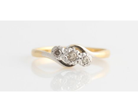 A three stone diamond ring, set with three graduated eight-cut diamonds, total diamond weight approx. 0.13ct, in a cross over