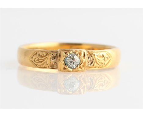 A Victorian 22ct yellow gold diamond solitaire ring, set with a central old cut diamond, measuring approx. 0.10ct, each shoul