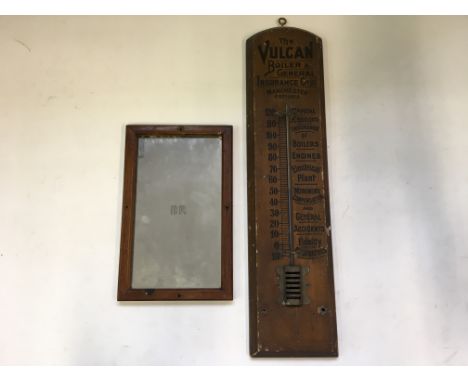 A Vulcan Boiler and General Insurance Co Ltd advertising barometer together with a British Rail mahogany framed mirror with B