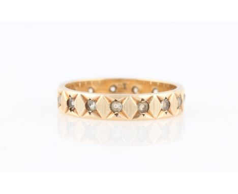 A paste full eternity ring, indistinctly stamped, ring size M.