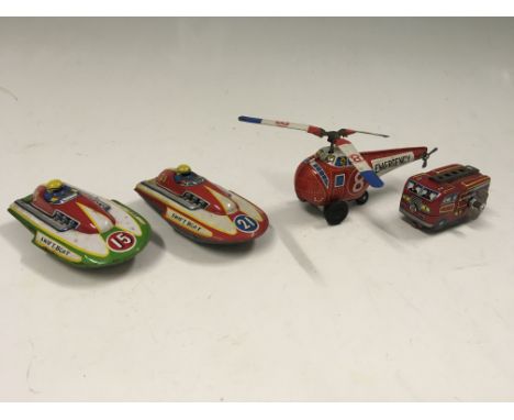 Four Japanese tinplate clockwork toys, including two Swift Boats 15 and 21, an emergency helicopter and a mini fire engine.