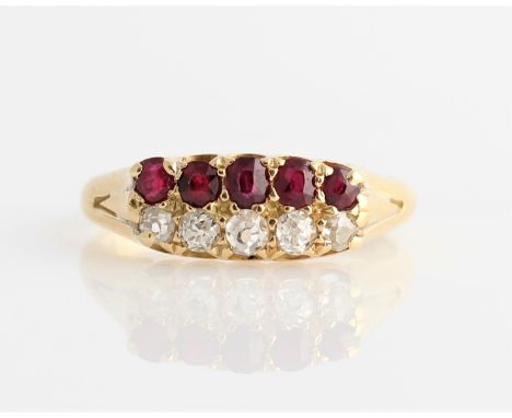 A Victorian 18ct yellow gold diamond and ruby two row ring, set with five graduated old cut diamonds, total diamond weight ap