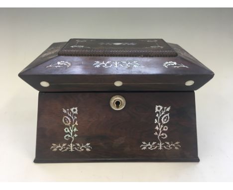 A tea caddy with mother of pearl detail.