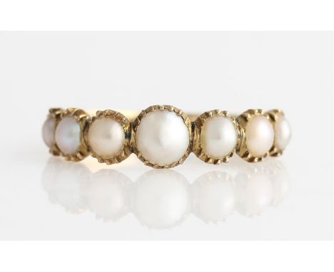 A 19th Century split pearl ring, set with seven graduated split pearls, unmarked yellow metal, ring size K½.