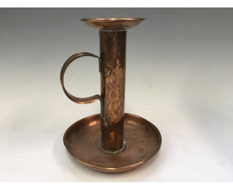 An Arts and Craft copper candlestick holder, height 25cm.