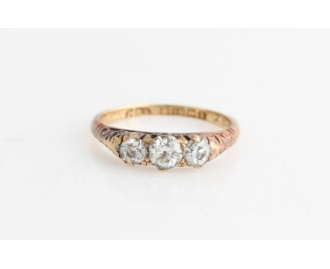 An 18ct yellow gold three stone diamond ring, set with three graduated old cut diamonds, total diamond weight approx. 0.60ct,