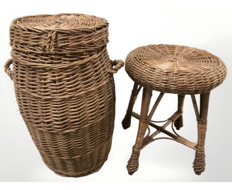 A wicker barrel shaped hamper and a small table.