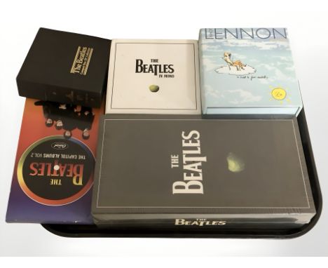Five The Beatles and John Lennon CD box sets.