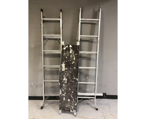 Two folding aluminium step ladders and a platform 