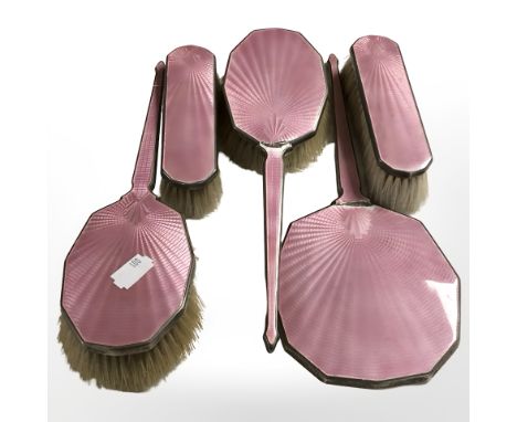 A silver and pink guilloche enamel five piece dressing table brush and mirror set, Birmingham marks, mirror 27.5 cm long.