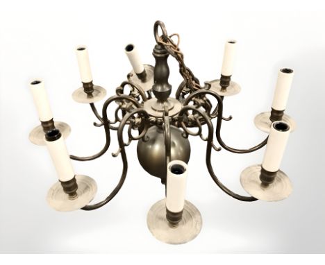 A brass eight scone chandelier 